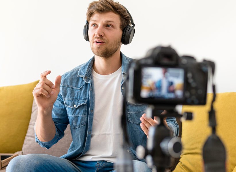 handsome-male-recording-personal-blog